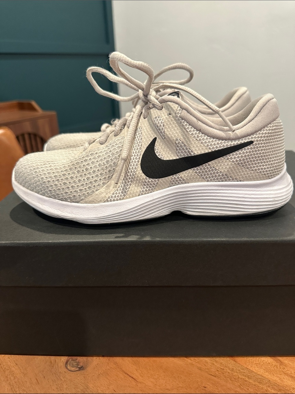 Nike Women’s Light Gray Mesh Running Shoes with Black Swoosh